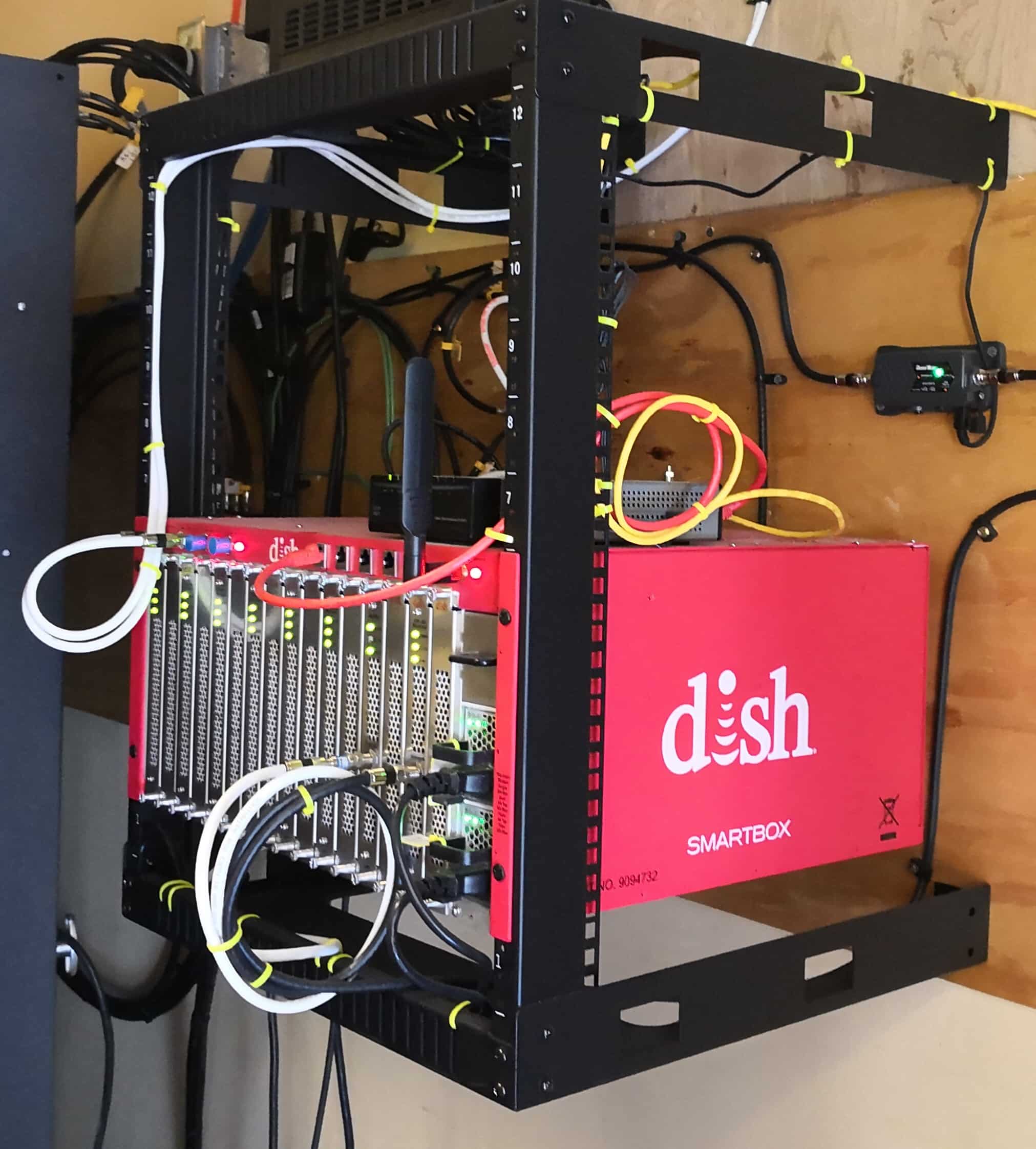 Technician working on commercial TV headend equipment